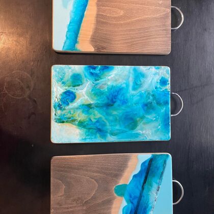 Epoxy serving boards with sea symbols are burned