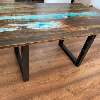 Epoxy kitchen table, where the space is filled with epoxy and various decorations