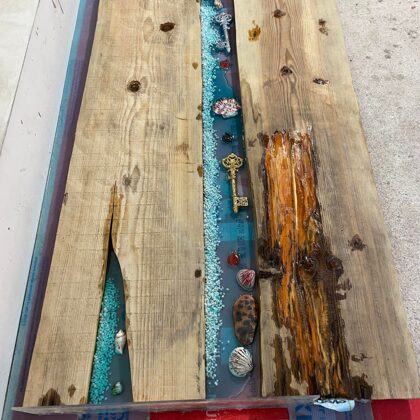 The process of casting a table top with epoxy