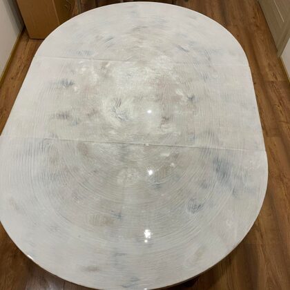 Kitchen table imitating marble surface coated with epoxy