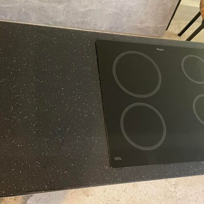 Kitchen tabletop with black epoxy, with added decorative glitter imitating a stone surface