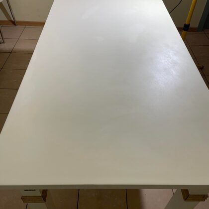 A transparent epoxy coating was applied to the painted dining table top