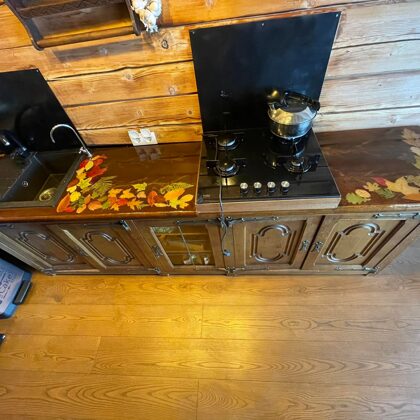 Restored kitchen surface with chocolate epoxy pigment and decors, leaves