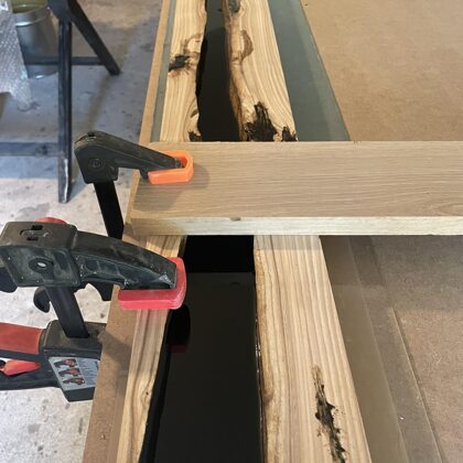 Casting process, elm stair railing with black epoxy bar