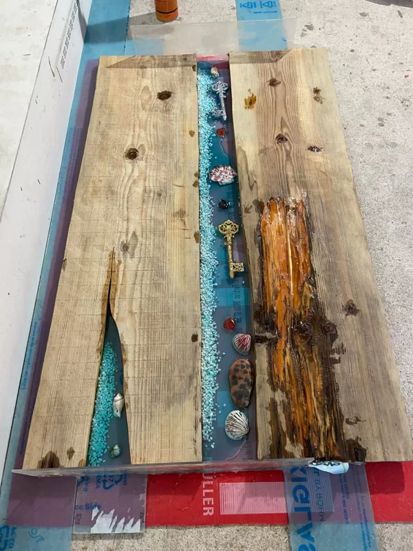 The process of casting a table top with epoxy