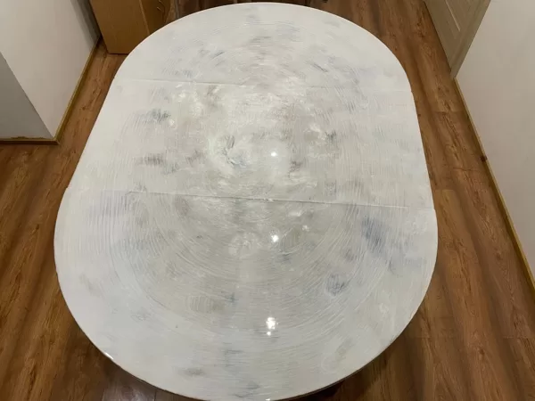 Kitchen table imitating marble surface coated with epoxy