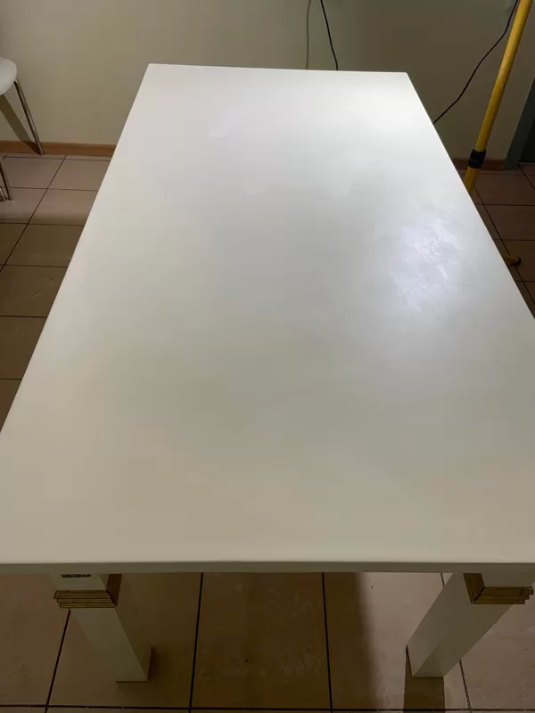 A transparent epoxy coating was applied to the painted dining table top