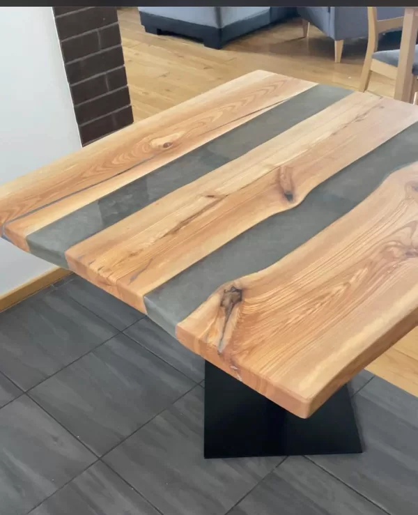 Ash table where the slots are filled with epoxy with metal legs