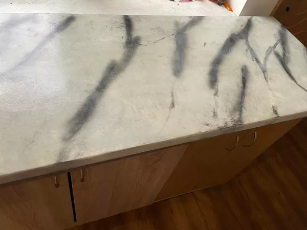 Epoxy coating imitating marble surface 4mm thick on a laminated surface