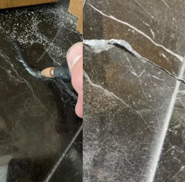 Restoration of marble floor tiles, cracks with epoxy.